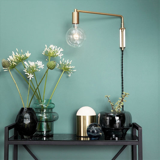 Hubsch Interior Scandi style grey and green hand blown glass vases on a marble side table with other vases and a gold lamp