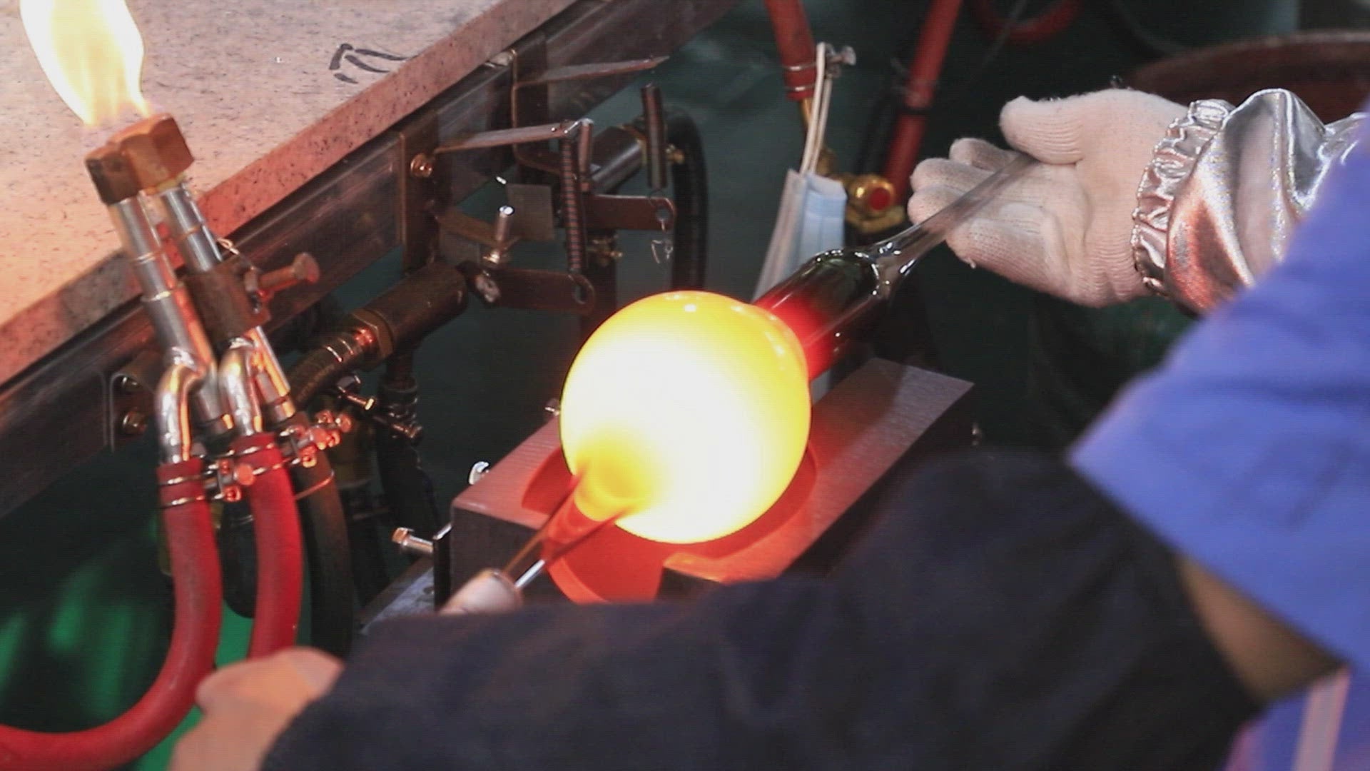 A making video showing the Marnie Carafe being handblown in borosilicate glass into a mould