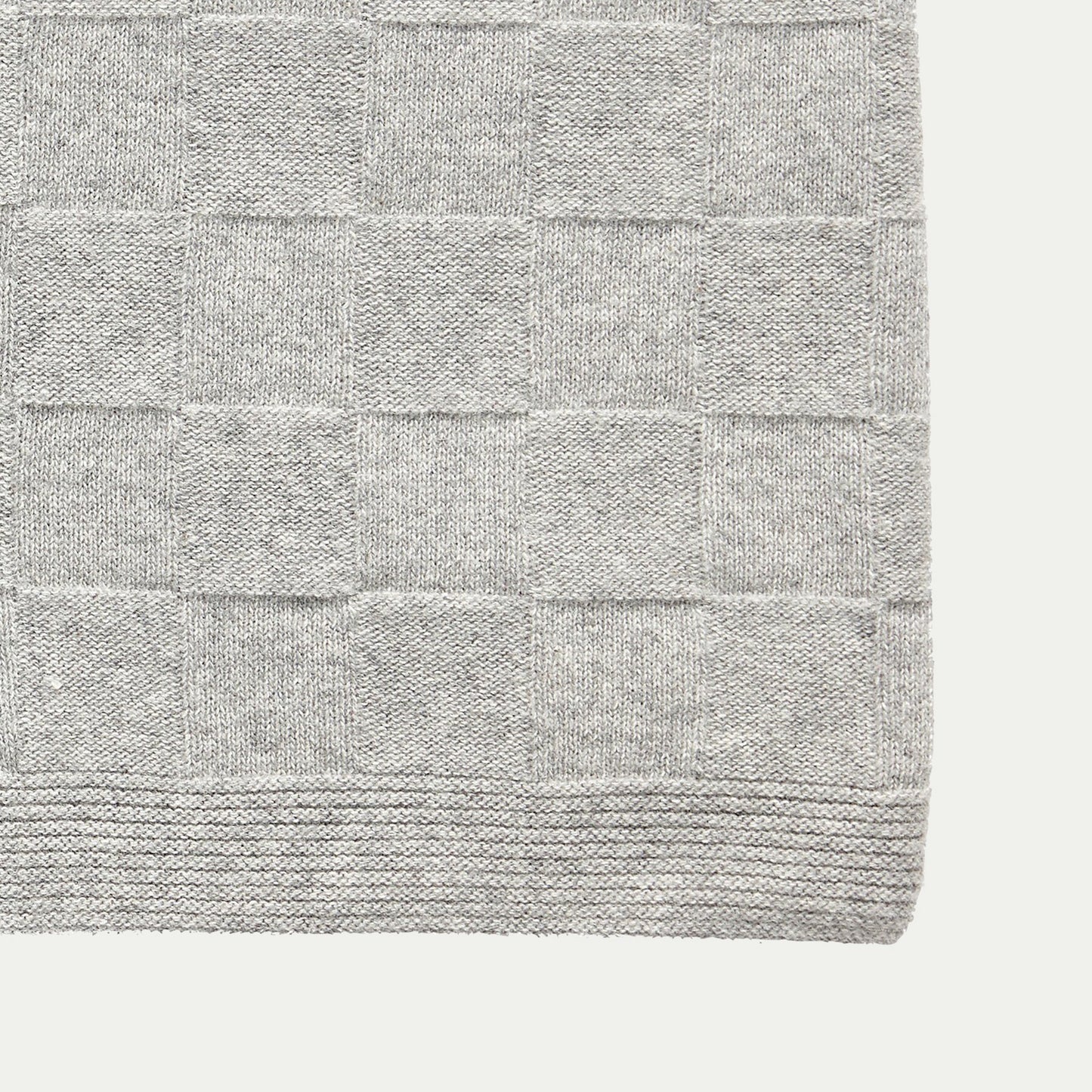 Close up of a Hubsch Interior large wool basket weave knit throw blanket in dove grey on white background